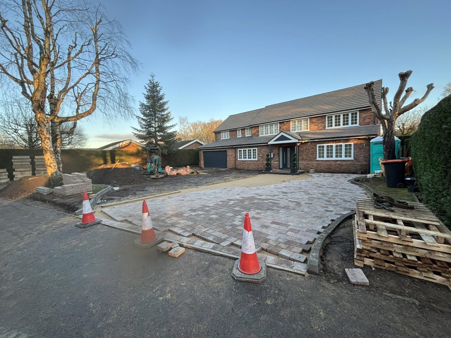 Block paving being laid around the driveway