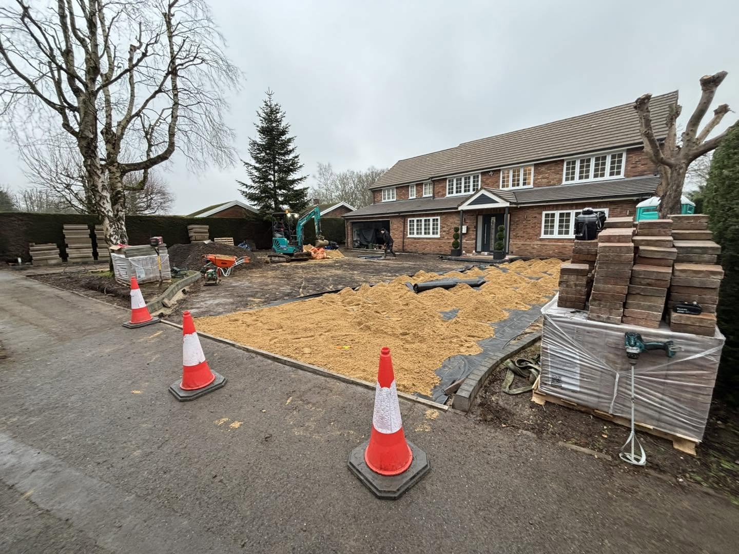 Sand and paving materials during driveway construction