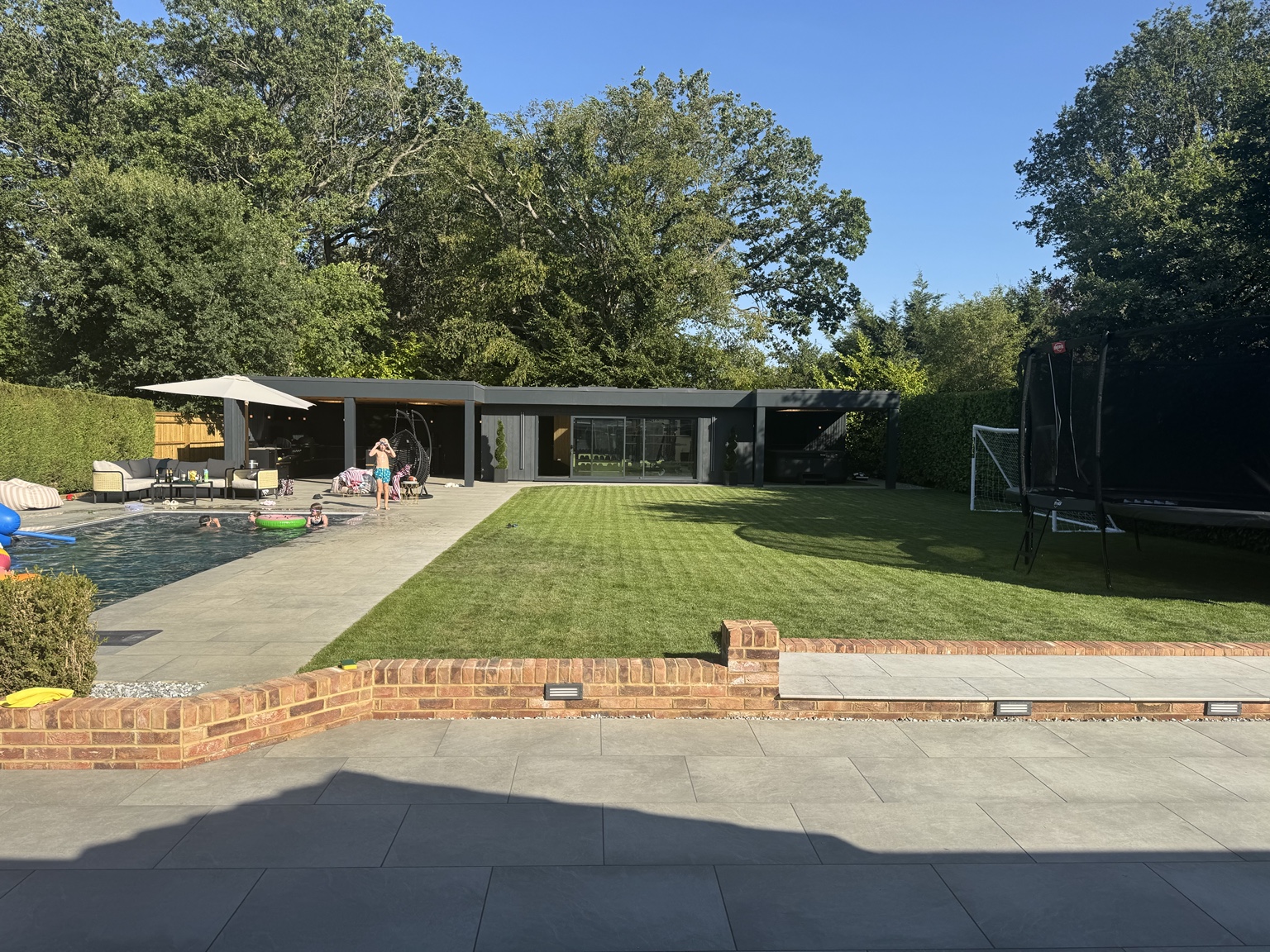 Completed back garden with lawn, patio and brick steps