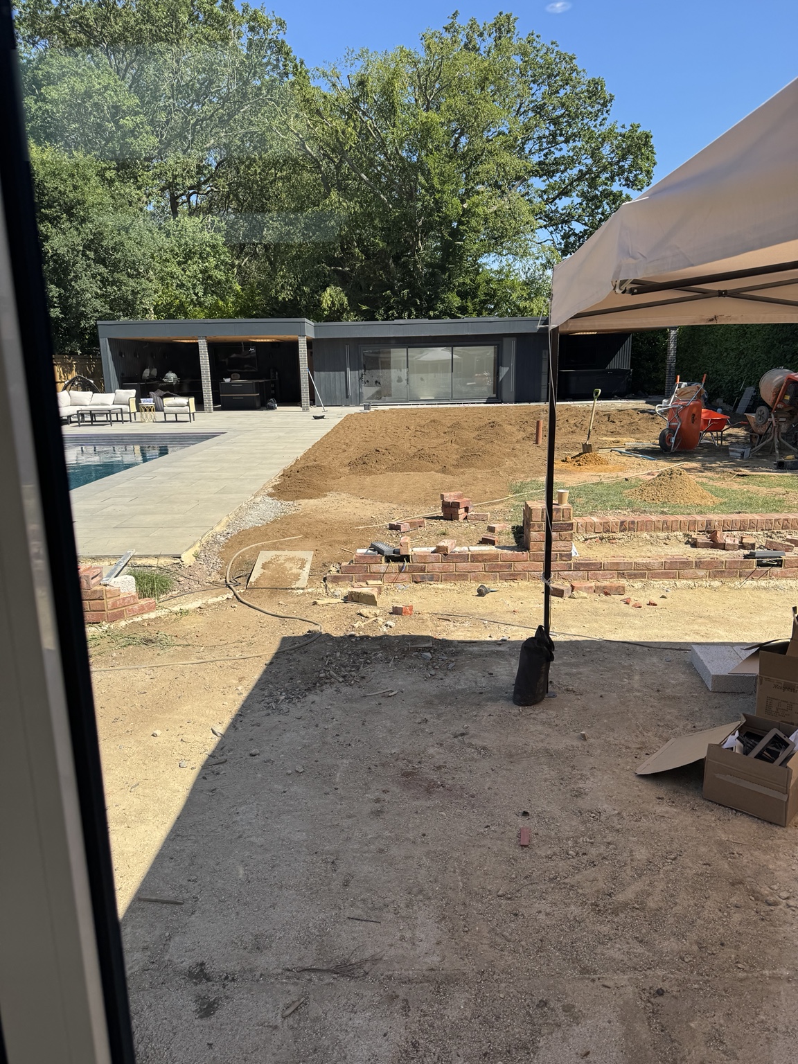 Lawn preparation and brick edging in progress